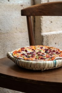 Michelin starred chef Alan Geaam imagined this pizzeria-style restaurant to highlight the manakish, a traditional Lebanese flat bread slathered with olive oil and zaatar.
