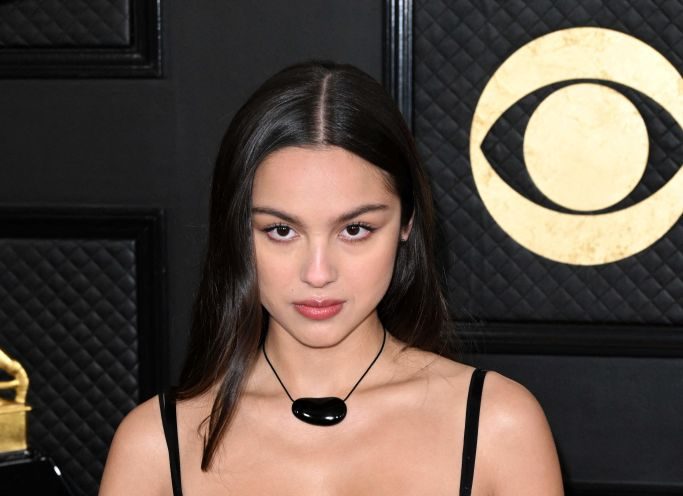 US singer Olivia Rodrigo wears sheer miu miu slip dress and arrives for the 65th Annual Grammy Awards at the Crypto.com Arena in Los Angeles on February 5, 2023. (Photo by Robyn BECK / AFP) (Photo by ROBYN BECK/AFP via Getty Images)
