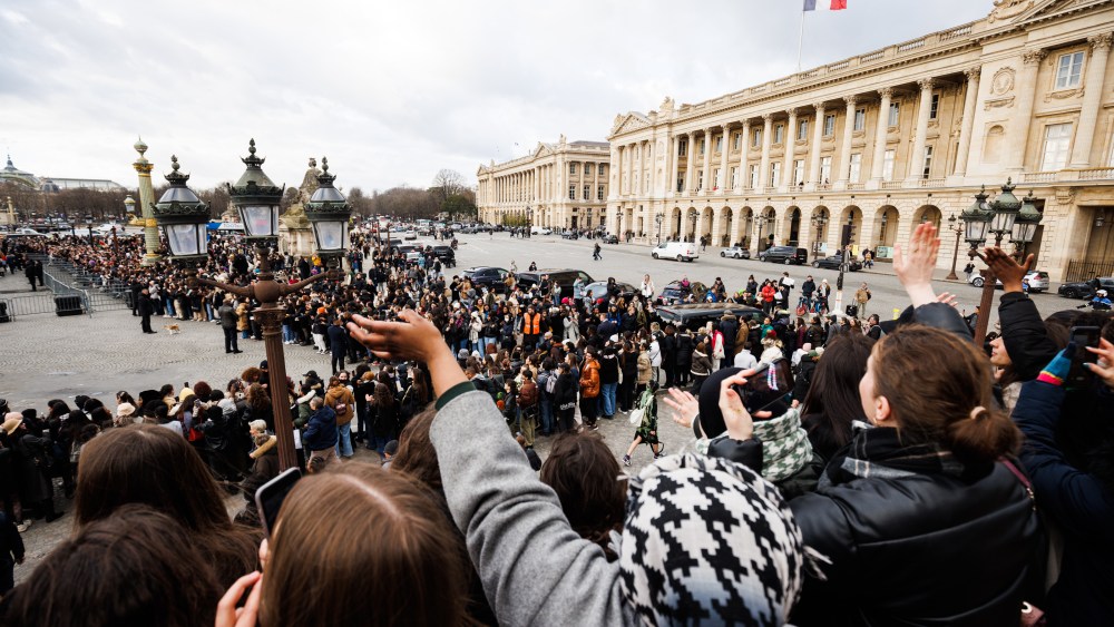 PARIS, FRANCE - JANUARY 20: Fans cheer as J-Hope leaves the Dior Homme Menswear Fall-Winter 2023-2024 show at Place de la Concorde as part of Paris Fashion Week on January 20, 2023 in Paris, France. (Photo by Richard Bord/Getty Images)