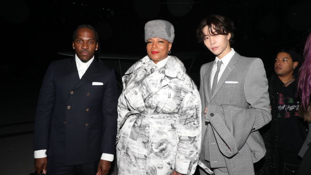 NEW YORK, NEW YORK - FEBRUARY 14: (L-R) Pusha T, Queen Latifah and John Suh attend the Thom Browne fashion show during New York Fashion Week at The Shed on February 14, 2023 in New York City. (Photo by Rob Kim/Getty Images)