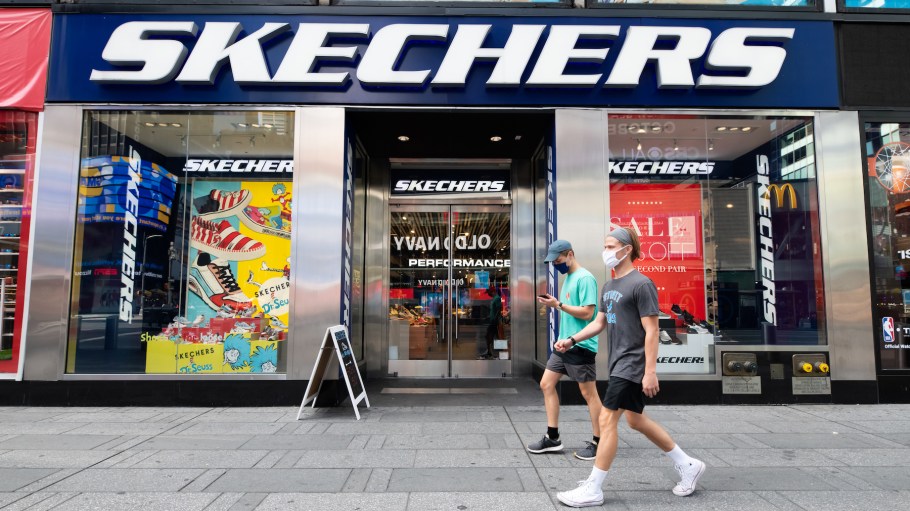 People wear protective face masks outside the Skechers store in Times Square as the city continues Phase 4 of re-opening following restrictions imposed to slow the spread of coronavirus on September 30, 2020 in New York City.