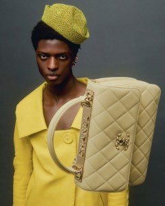Chanel’s lambskin handbag. Prada leather coat; The Attico tweed hat; Oscar de la Renta flower earring; prop stylist’s own gloves.