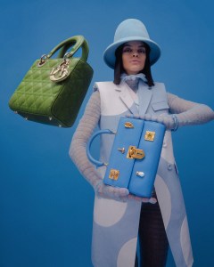 Dior’s Lady Dior handbag and Schiaparelli’s Bijoux Secret handbag. Thom Browne tulle bodysuit and oxford cotton vests; Esenshel felt hat; David Yurman Renaissance cuff in aluminum.