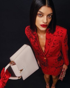 Louis Vuitton’s Capucines BB handbag. Schiaparelli wool jacket and skirt; Valentino Garavani Toile Iconographe Loco handbag; Schiaparelli shoes; prop stylist’s own gloves.