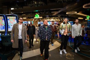 You People. (L to R) Bryan Greenberg as Isaac, Eddie Murphy as Akbar, Jonah Hill (Writer-Producer) as Ezra, Travis Bennet as Omar, Andrew Schulz as Cousin Avi and Jordan Firstman as Danny in You People. Cr. Parrish Lewis/Netflix © 2023.