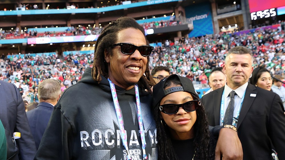 GLENDALE, ARIZONA - FEBRUARY 12: Jay-Z poses looks on with his daughter Blue Ivy Carter before Super Bowl LVII between the Kansas City Chiefs and the Philadelphia Eagles at State Farm Stadium on February 12, 2023 in Glendale, Arizona. (Photo by Christian Petersen/Getty Images)