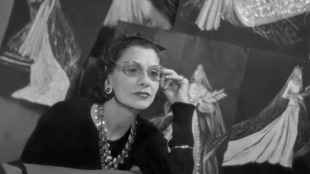 coco chanel quotes, Book cover use of this asset requires approval. Please contact your Account Representative. Mandatory Credit: Photo by Roger Schall/Condé Nast/Shutterstock (11807239a) Designer Coco Chanel wearing large-rimmed glasses surrounded by sketches of her designs. Coco Chanel Vogue May 01, 1938 Portrait