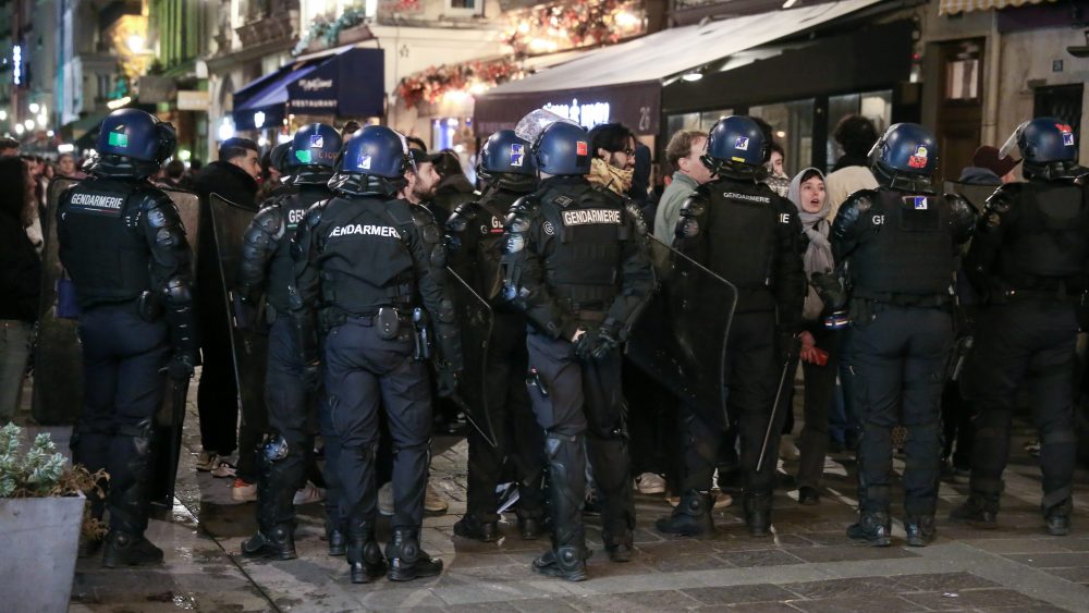 French gendarmes block demonstrators during an unauthorized rally in Paris, in the Forum district of Les Halles, on March 19, 2023, against plans to reform pensions three days after the French government imposed the reform without a vote in using Article 49.3 of the Constitution. Opponents of the French president's pension reform plan are expressing their anger for the third evening, with new rallies and strikes in a France, plunged into a political crisis after the executive took power. (Photo by Michel Stoupak/NurPhoto via Getty Images)