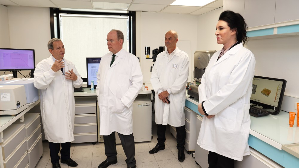 Prince Albert II of Monaco and Sue Nabi (second and fourth from left) at Lancaster's laboratory.