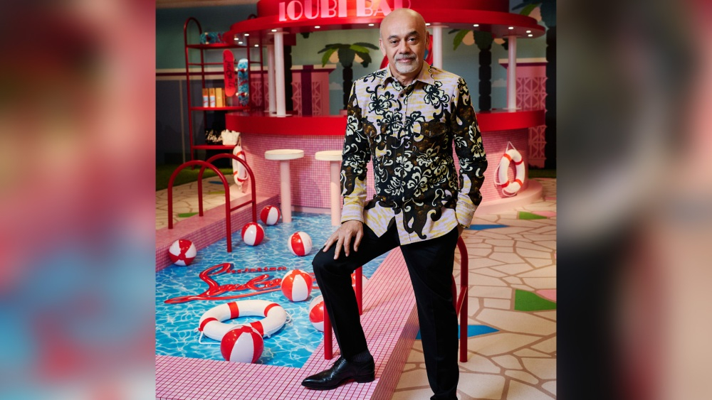 Christian Louboutin at his "A La Piscine" installation at Neiman Marcus NorthPark.