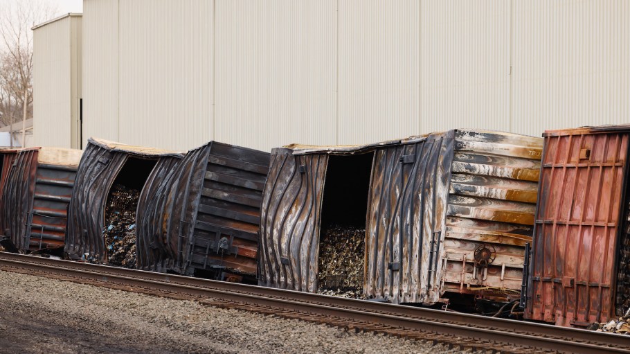 Charred train cars sit near railroad tracks on Feb. 14, 2023 in East Palestine, Ohio. The Norfolk Southern train derailed on Feb. 3, releasing toxic fumes and forcing evacuation of residents.
