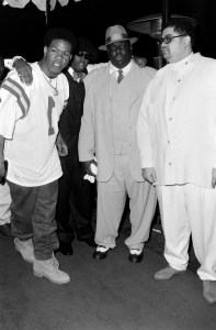 Craig Mack, Sean Combs, Christopher "Notorius B.I.G" Wallace, and Dwight "Heavy D" Myers attend a Grammy's party at the Beverly Hilton Hotel in Los Angeles on March 3, 1995. Wallace and Myers are outfitted in suits from 5001 Flavors Menswear.