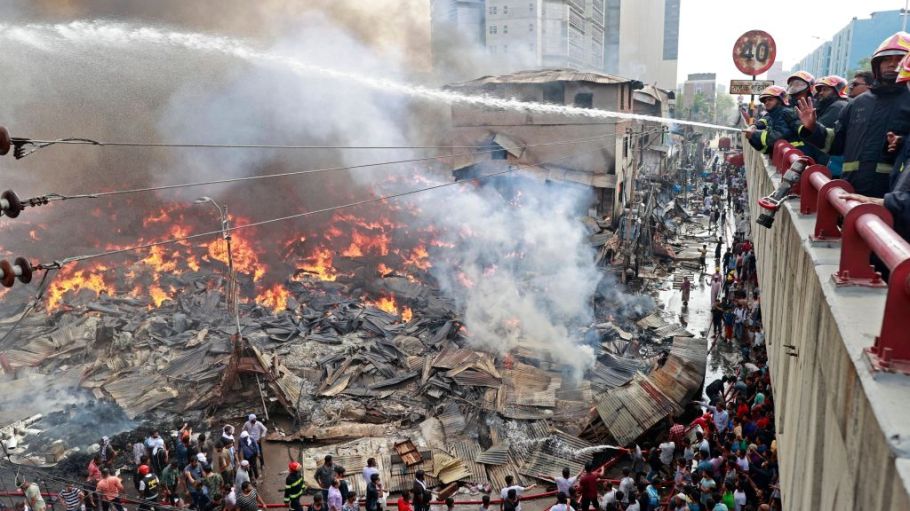 Firefighters try to extinguish a fire that broke out in a clothing market in Dhaka on April 4, 2023.