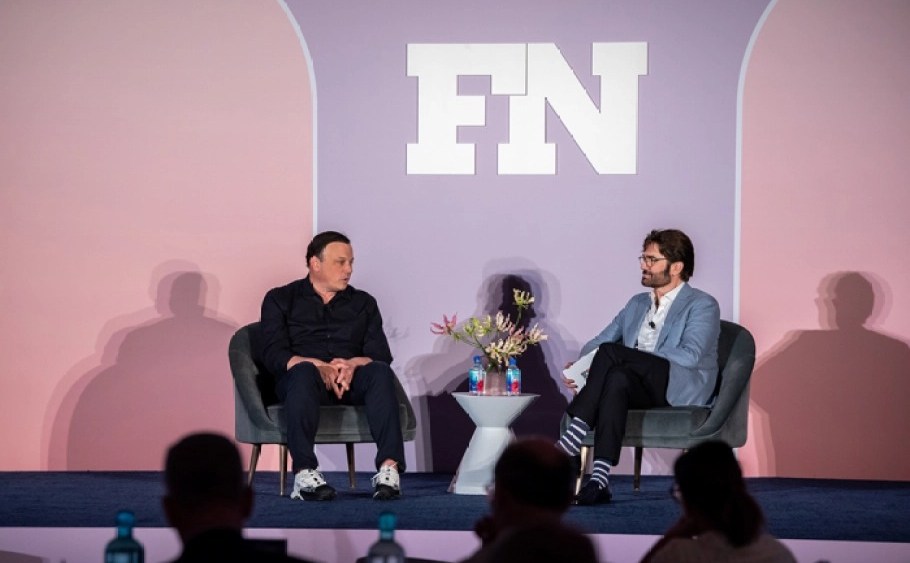 Brendan Hoffman, left, speaks with Michael Atmore, right, at the 2023 FN CEO Summit held at The Ritz-Carlton South Beach on April 20, 2023 in Miami Beach, Fla.