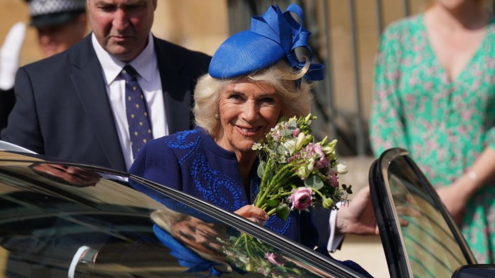 Camilla, Queen Consort waves to wellwishers after attending the Easter Mattins Service at Windsor Castle on April 9, 2023 in Windsor, England.
