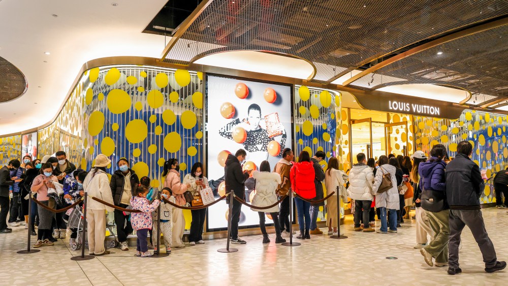 People line up at the Louis Vuitton store at the Taikoo Li Qiantan Mall in Shanghai, China.