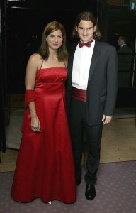 LONDON - JULY 6:  Wimbledon singles champion Roger Federer of Switzerland and girlfriend Miroslava Vavrinec pose for photographs prior to attending the Wimbledon Ball at the Savoy Hotel on July 6, 2003 in London.  (Photo by Alex Livesey/Getty Images)