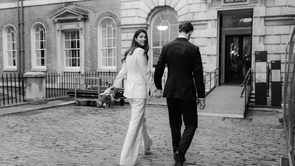 A London bride wearing a tailored suit by The Deck on Savile Row.