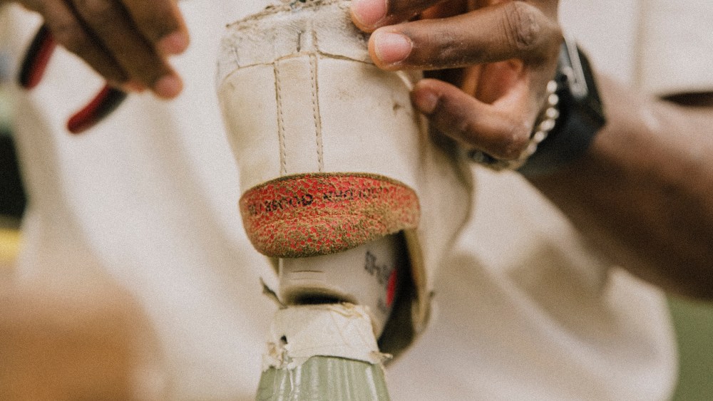 Golden Goose artisans repairing a shoe.