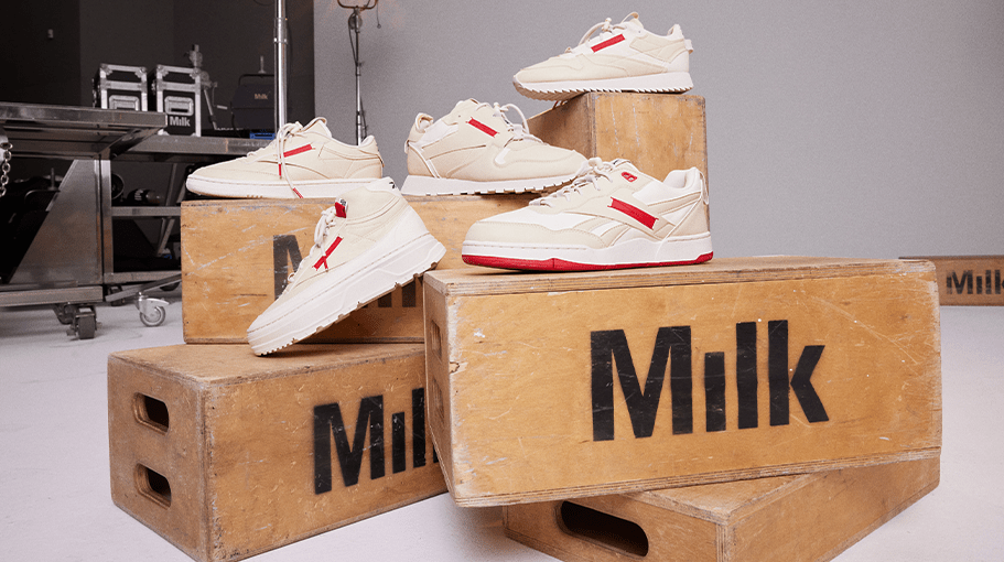 White and red sneakers placed on photo studio equipment