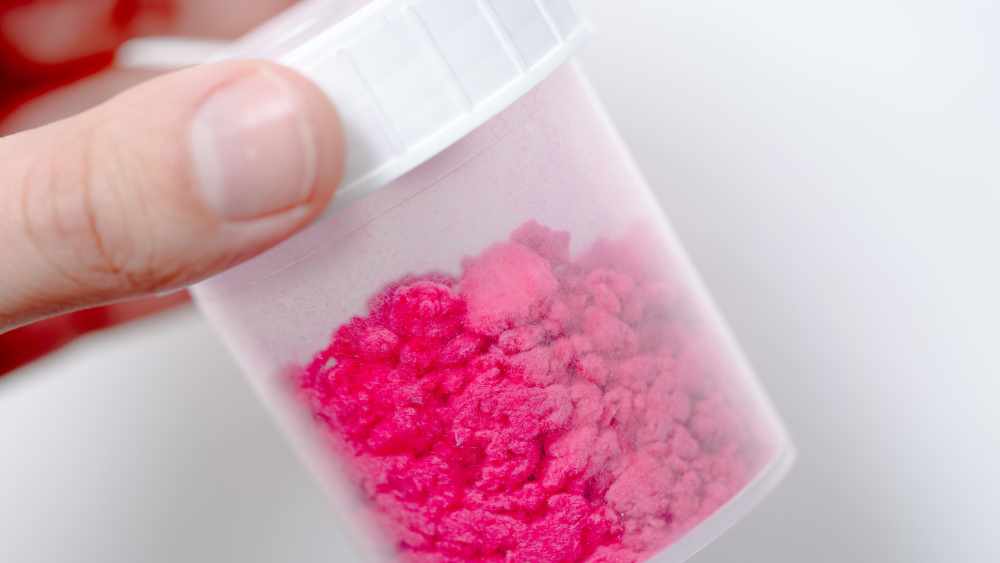 A Xeros filter resembling a medical canister of fuchsia microfibers.