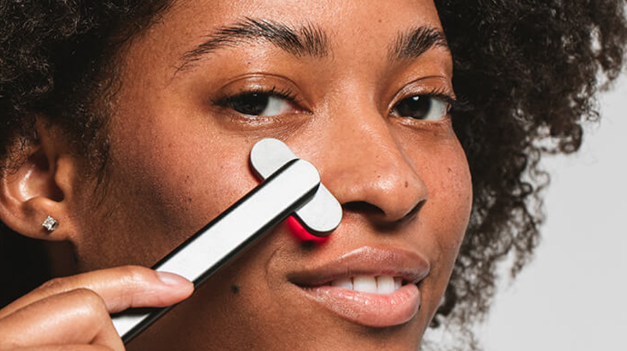 Woman using a skin care tool