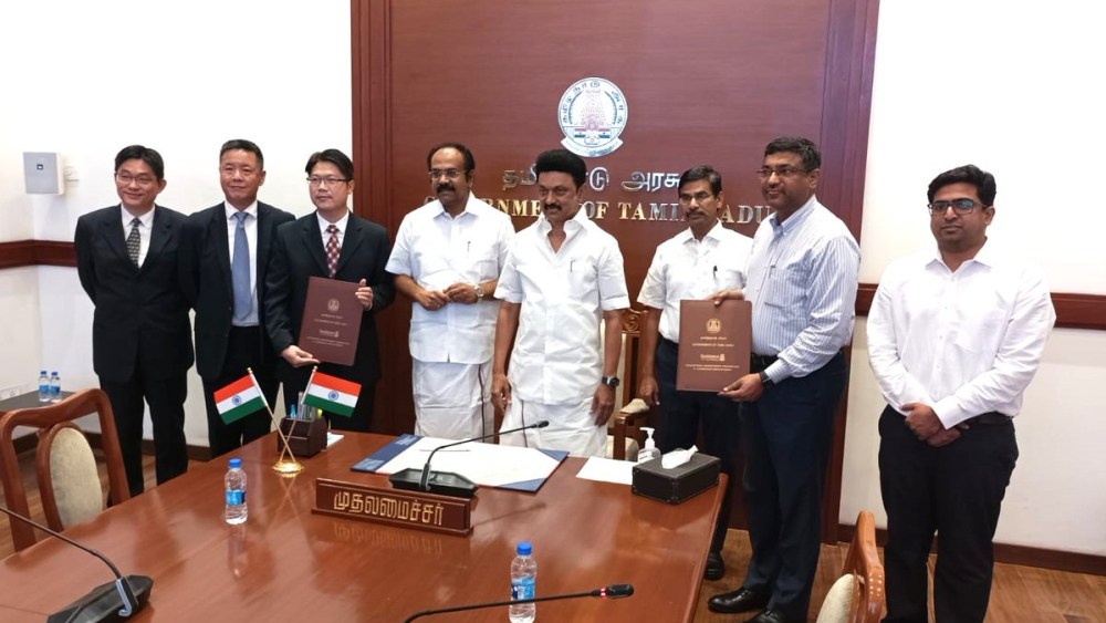 Tamil Nadu government representatives sign an MOU with Pou Chen execs.