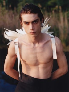 Loewe’s parchment wings and Ferragamo’s wool double natté trousers. Ben-Amun by Isaac Manevitz pearl and crystal earring.