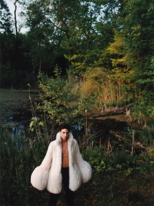 Loewe’s shearling poodle sleeve in white and Bally’s leather pants. Loewe boots.