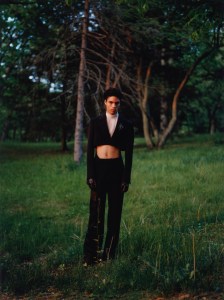 Alexander McQueen’s wool jacket, Saint Laurent’s wool and silk trousers and Sacai’s polyester sheer top. Maison Margiela leather gloves; Thorne Dynasty dagger huggie earring with David Yurman shark tooth amulet in sterling silver with pavé black diamonds; RJ Graziano’s crystal brooch; Saint Laurent boots.