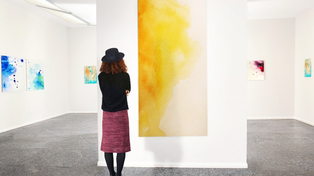 Young woman in modern art gallery