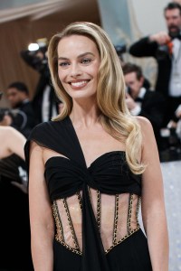 Margot Robbie wears hair by Bryce Scarlett, and makeup by Pati Dubroff.