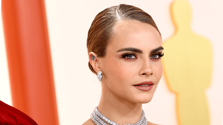 Cara Delevingne shows off her signature fluffy and full eyebrows at the 2023 Academy Awards.