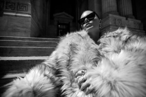 Aknvas’ modacrylic, acrylic and polyester coat. Saint Laurent sunglasses; Other People’s Property sterling silver Pearl Halo Drop Earrings with ethically sourced pearls and peridots, and 14-karat yellow gold 2 Step Deco Ring with ethically sourced diamond; Kinn 14-karat solid gold and sterling silver Double Dare to Love Dome ring.