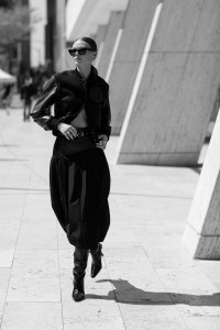 3.1 Phillip Lim’s wool and polyamide varsity jacket and belted lamb leather yoke combo skirt. Staud boots; Saint Laurent sunglasses; Numbering earrings; Kloto 18-karat gold Veer bracelet and 18-karat gold and sterling silver Geo ring; Kinn 14-karat white gold Madison Diamond Tennis bracelet and 14-karat solid gold and sterling silver Double Dare to Love Dome ring; Other People’s Property Sterling Silver Axle ring with ethically sourced natural blue sapphires and 14-karat yellow gold 2 Step Deco Ring with ethically sourced diamonds.