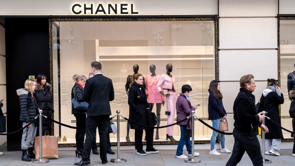 Queue outside Chanel on New Bond Street in London, United Kingdom.