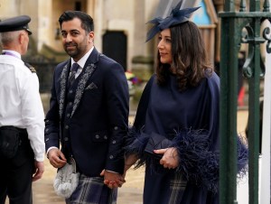 LONDON, ENGLAND - MAY 06: First Minister of Scotland Humza Yousaf and his wife Nadia El-Nakla arrive at Westminster Abbey ahead of the Coronation of King Charles III and Queen Camilla on May 6, 2023 in London, England. The Coronation of Charles III and his wife, Camilla, as King and Queen of the United Kingdom of Great Britain and Northern Ireland, and the other Commonwealth realms takes place at Westminster Abbey today. Charles acceded to the throne on 8 September 2022, upon the death of his mother, Elizabeth II. (Photo by Andrew Milligan - WPA Pool/Getty Images)