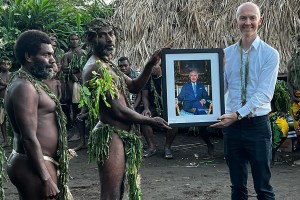 Villagers from Iaohnanen and Yakel on Vanuatu's Tanna island receive a portrait of Britain's King Charles III from Britain's Acting High Commissioner Michael Watters on May 6, 2023, ahead of the coronations in London of Britain's King Charles III and Britain's Camilla, Queen Consort. (Photo by Ben BOHANE / AFP) (Photo by BEN BOHANE/AFP via Getty Images)
