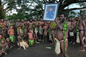 Villagers from Iaohnanen and Yakel on Vanuatu's Tanna island pose with a portrait Britain's King Charles III on May 6, 2023, ahead of the coronations in London of Britain's King Charles III and Britain's Camilla, Queen Consort. (Photo by Ben BOHANE / AFP) (Photo by BEN BOHANE/AFP via Getty Images)
