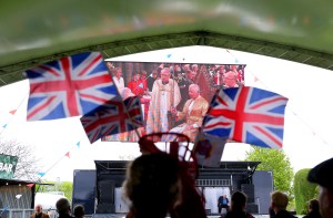 Racegoers watch the coronation ceremony of King Charles III on a big screen ahead of day two of The QIPCO Guineas Festival at Newmarket Racecourse. Picture date: Saturday May 6, 2023. (Photo by Nigel French/PA Images via Getty Images)