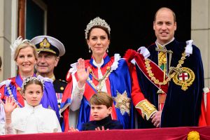 Britain's Prince William, Prince of Wales, Britain's Catherine, Princess of Wales, Britain's Princess Charlotte of Wales and Britain's Prince Louis of Wales wave to the crowds from the Buckingham Palace balcony as they wait for the Royal Air Force fly-past in central London on May 6, 2023, after the coronations of King Charles III and Queen Camilla. - The set-piece coronation is the first in Britain in 70 years, and only the second in history to be televised. Charles will be the 40th reigning monarch to be crowned at the central London church since King William I in 1066. Outside the UK, he is also king of 14 other Commonwealth countries, including Australia, Canada and New Zealand. Camilla, his second wife, was crowned Queen alongside him. (Photo by Leon Neal / POOL / AFP) (Photo by LEON NEAL/POOL/AFP via Getty Images)