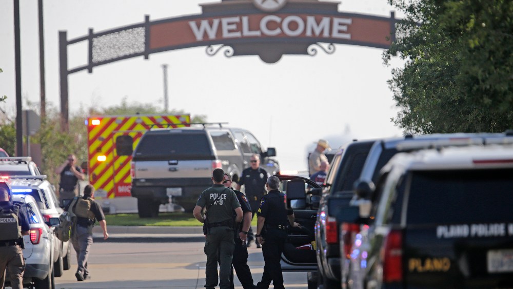 Emergency personnel work the scene of the shooting at Allen Premium Outlets on May 6, 2023.