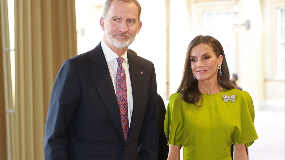 King Felipe VI and Queen Letizia of Spain wearing green victoria beckham dress at the Coronation Reception for overseas guests at Buckingham Palace on May 5 in London.