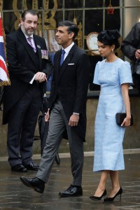 LONDON, ENGLAND - MAY 06: British Prime Minister Rishi Sunak and Akshata Murthy arrive at the Coronation of King Charles III and Queen Camilla on May 06, 2023 in London, England. The Coronation of Charles III and his wife, Camilla, as King and Queen of the United Kingdom of Great Britain and Northern Ireland, and the other Commonwealth realms takes place at Westminster Abbey today. Charles acceded to the throne on 8 September 2022, upon the death of his mother, Elizabeth II. (Photo by Jeff J Mitchell/Getty Images)