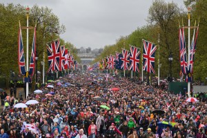 LONDON, ENGLAND - MAY 06: A general view of members of the public gathering outside Buckingham Palace after the ceremony during the Coronation of King Charles III and Queen Camilla on May 06, 2023 in London, England. The Coronation of Charles III and his wife, Camilla, as King and Queen of the United Kingdom of Great Britain and Northern Ireland, and the other Commonwealth realms takes place at Westminster Abbey today. Charles acceded to the throne on 8 September 2022, upon the death of his mother, Elizabeth II. (Photo by Dan Mullan/Getty Images)