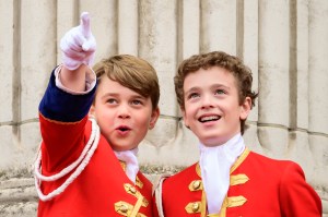 LONDON, ENGLAND - MAY 06: Prince George (L) points while on the balcony of Buckingham Palace during the Coronation of King Charles III and Queen Camilla on May 06, 2023 in London, England. The Coronation of Charles III and his wife, Camilla, as King and Queen of the United Kingdom of Great Britain and Northern Ireland, and the other Commonwealth realms takes place at Westminster Abbey today. Charles acceded to the throne on 8 September 2022, upon the death of his mother, Elizabeth II.  (Photo by Leon Neal/Getty Images)
