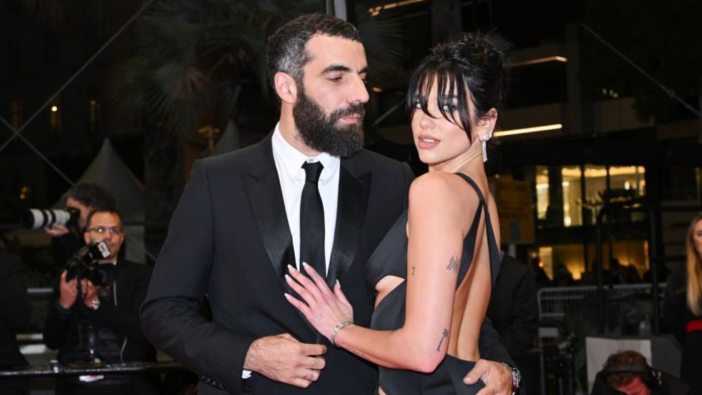 Romain Gavras and Dua Lipa and attend the "The King of Algiers" premiere at Cannes Film Festival on May 19 in Cannes, France.