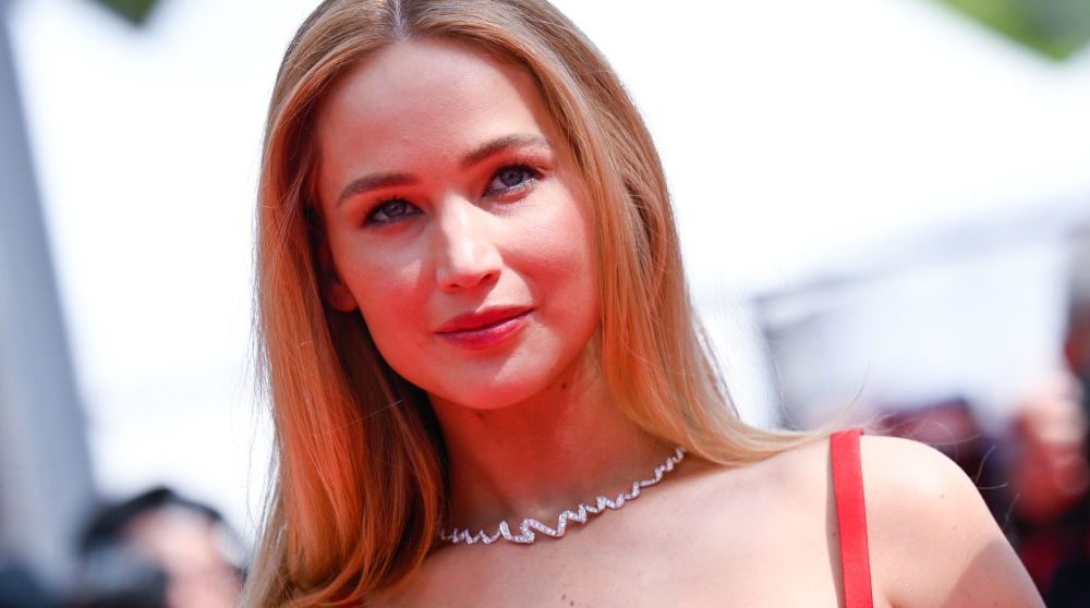CANNES, FRANCE - MAY 21: Jennifer Lawrence wears red dior dress, attends the "Anatomie D'une Chute (Anatomy Of A Fall)" red carpet during the 76th annual Cannes film festival at Palais des Festivals on May 21, 2023 in Cannes, France. (Photo by Stephane Cardinale - Corbis/Corbis via Getty Images)