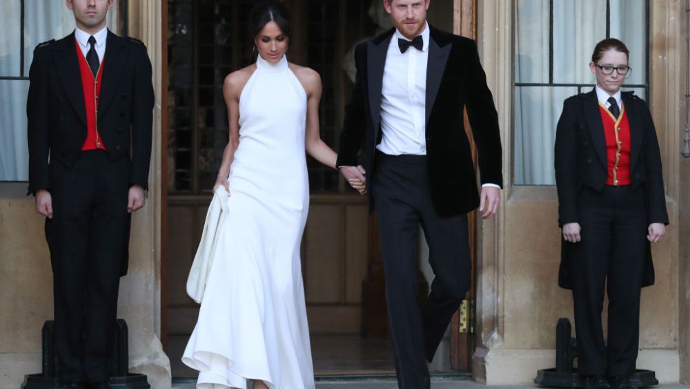 WINDSOR, UNITED KINGDOM - MAY 19: Duchess of Sussex and Prince Harry, Duke of Sussex leave Windsor Castle after their wedding to attend an evening reception at Frogmore House, hosted by the Prince of Wales on May 19, 2018 in Windsor, England. (Photo by Steve Parsons - WPA Pool/Getty Images)