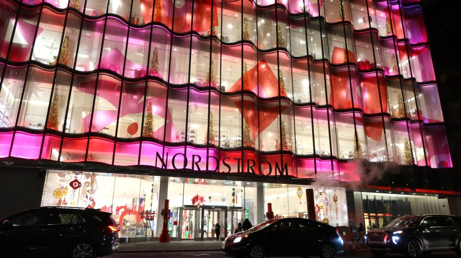 People walk past the Nordstrom department store on 57th Street as it is decorated for Christmas on November 30, 2022, in New York City.